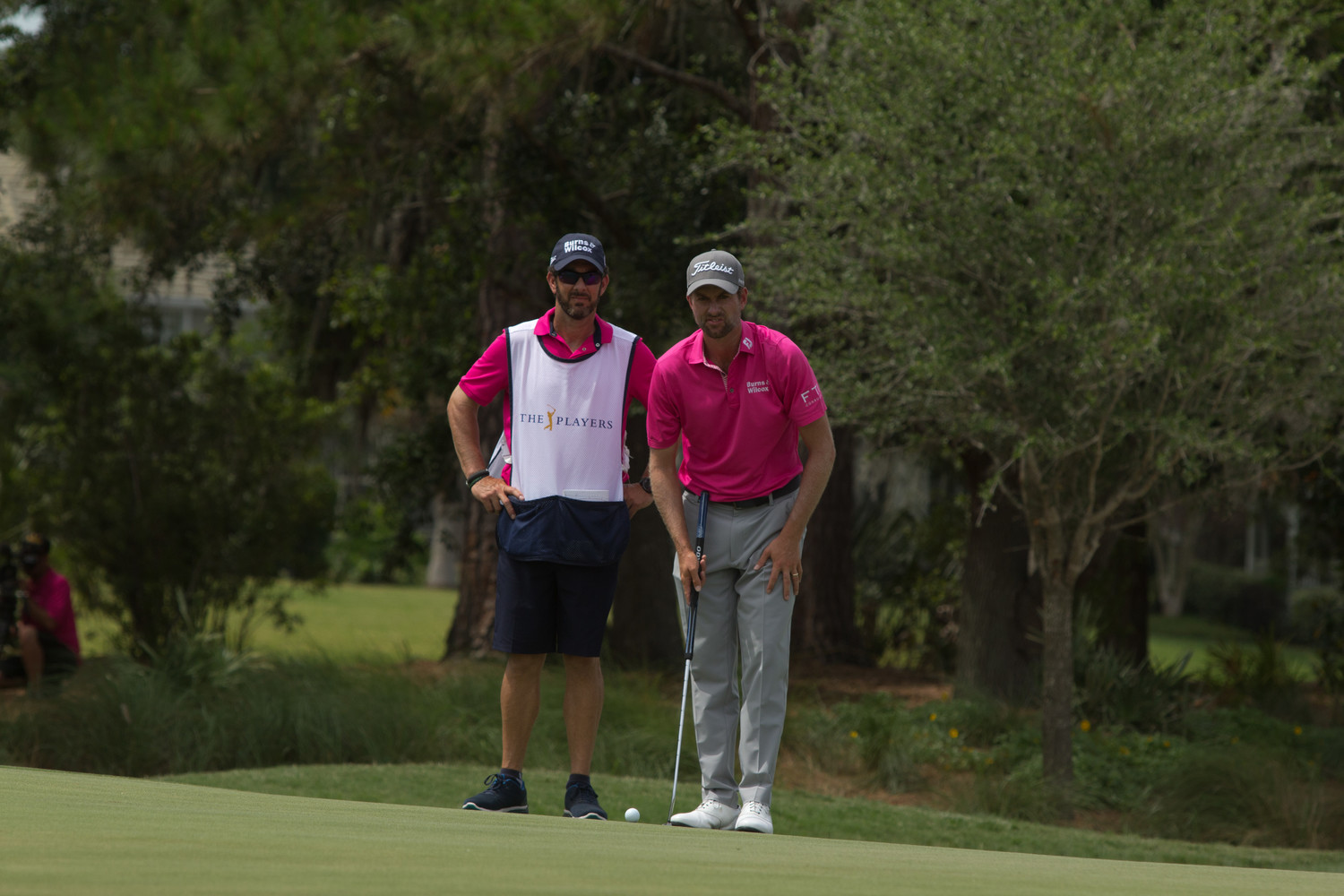 Paul Tesori, the caddie for THE PLAYERS Championship 2018 winner Webb Simpson and a Nocatee resident, surveys the field with Simpson during the final round of the tournament.